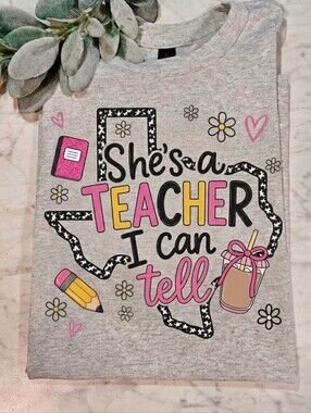 Teacher shirt Shes A Teacher I can Tell cute popular trending school Texas